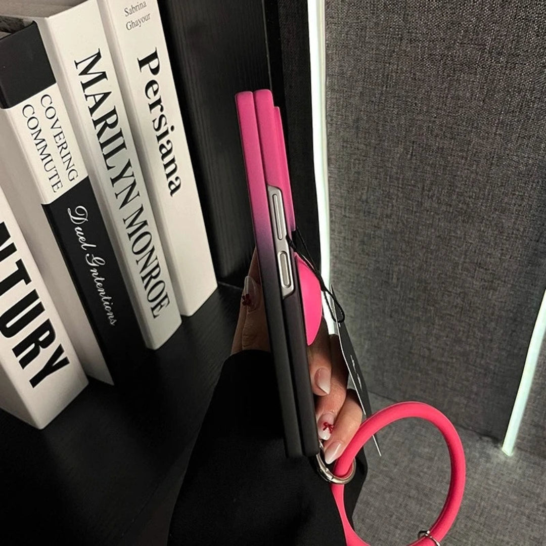 Pink phone case with a stethoscope held against books on a shelf.