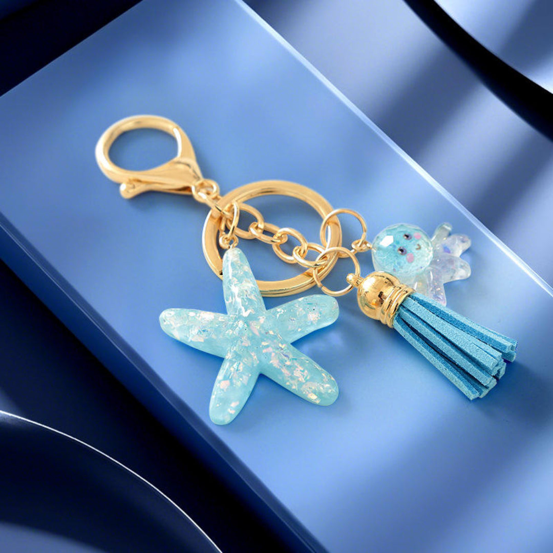 Keychain with starfish charm and tassel on a blue background